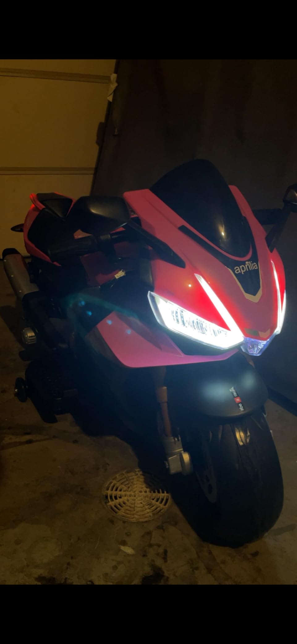 TCARAIWEN Aprilia Licensed 24V Kids Electric Motorcycle, Speed Up to 8mph Ride-On Motorcycle with Training Wheels, Key Switch and Mp3 (Normal Motors - 24V, Pink) customer photo 1