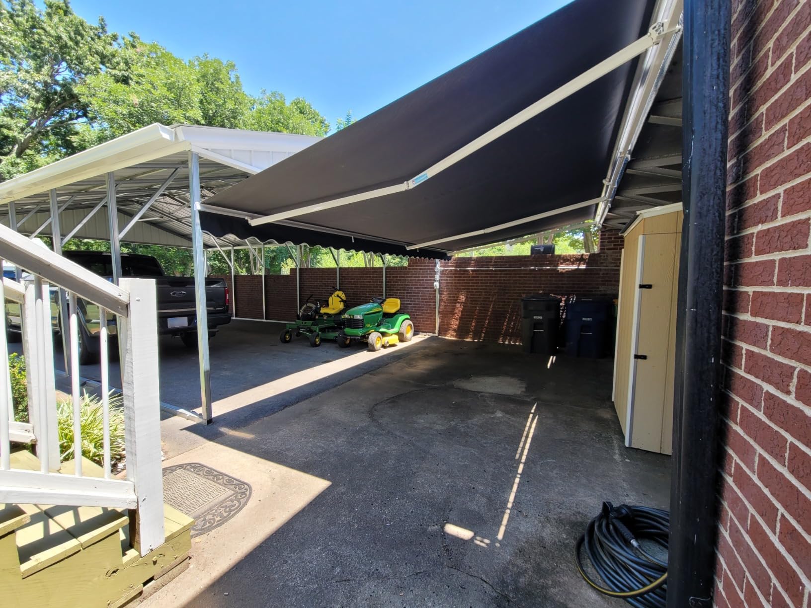 ALEKO Electric Patio Awning Caribbean White Frame 10x8 Black | Retractable sunshade for decks and balconies, remote-controlled extension, water-resistant fabric, rust-free aluminum frame customer photo 1
