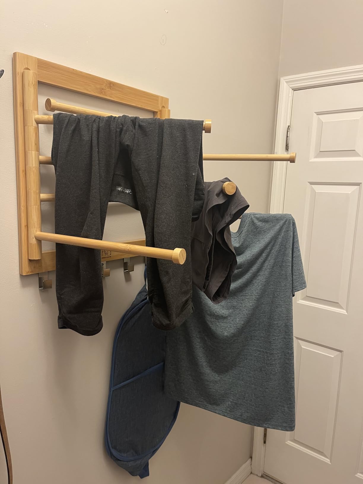 Honey-Can-Do Bamboo Wall-Mount Swivel-Arm Drying Rack, 80 lb, Natural | Wall-mount bamboo rack with 8 swivel arms holds 80 lb; folds to 1.7 in deep. Ships assembled with 5 steel hooks. customer photo 2