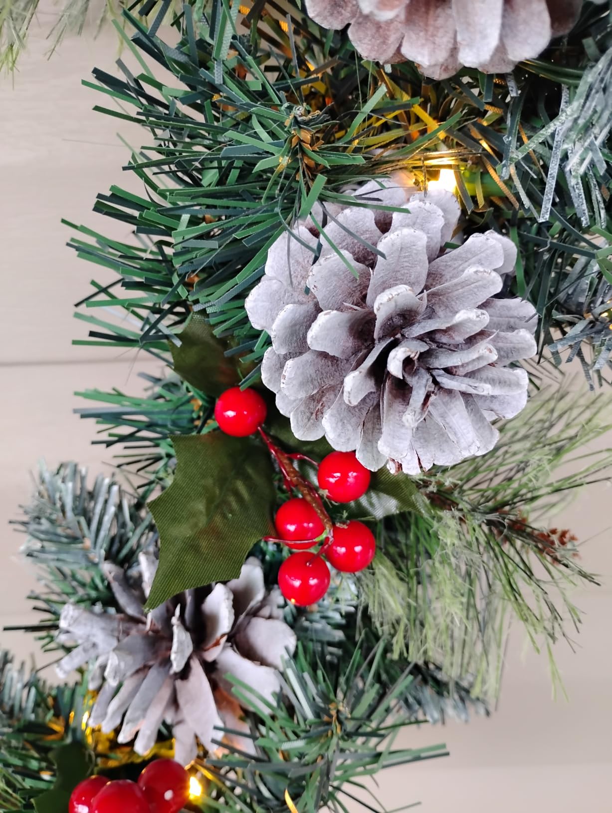 9ft Flocked Pre-Lit Artificial Christmas Garland with Lights | Battery operated Xmas decor adorned with natural pine cones & red berry clusters. Ideal for indoor mantel or stair railings. customer photo 1