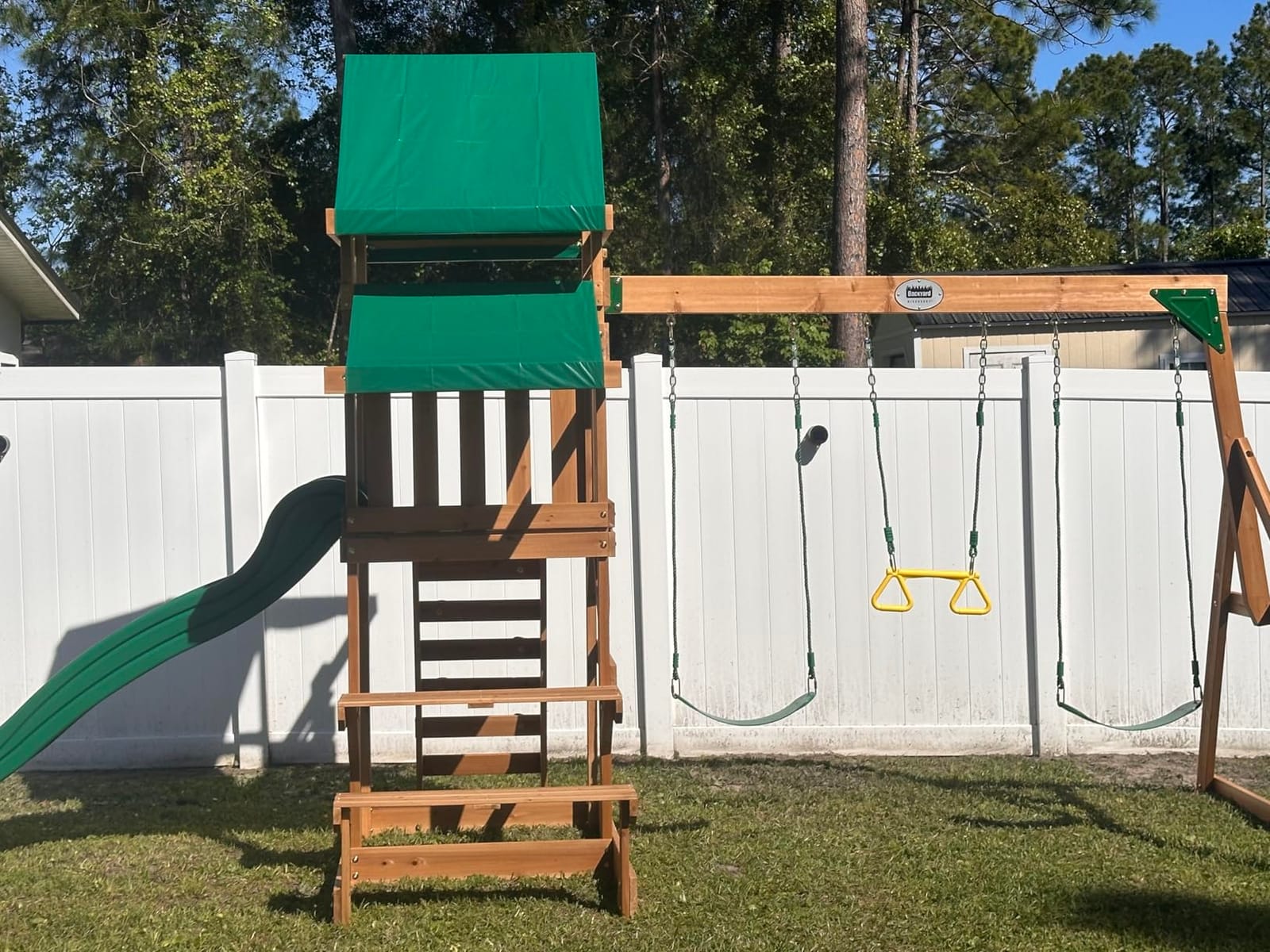 Backyard Discovery Beach Front Cedar Wood Swing Set with Wave Slide, Play Deck, Monkey Bars, Rock Wall Ladder, Shaded Picnic Area, Snack Bar, Belt Swings, Trapeze, Sandbox Area, Outdoor Playset customer photo 2