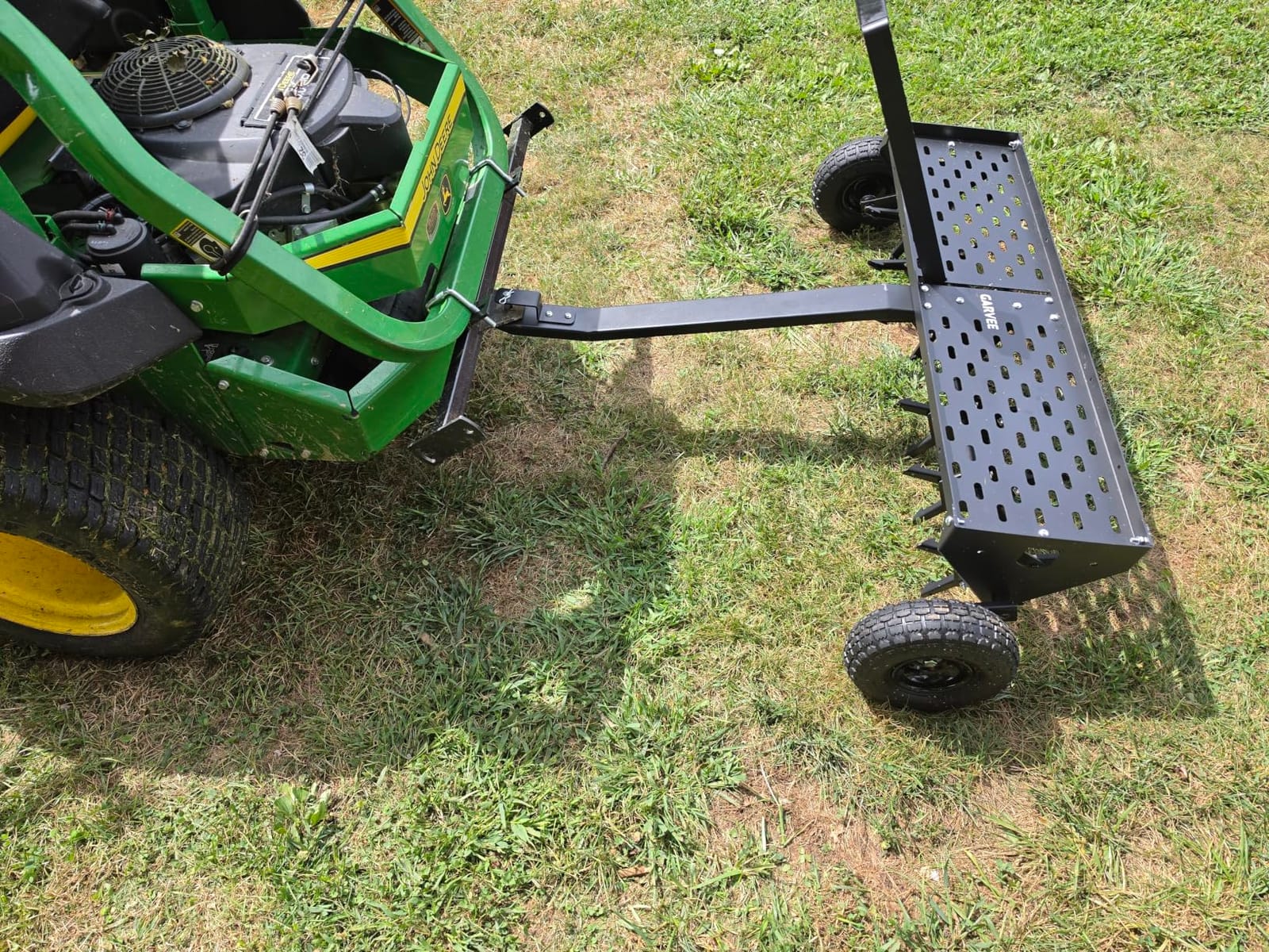 Garvee 48-Inch Tow Behind Plug Aerator,Pull Behind Aerator with Durable Steel Tines Lawn & Tray and Pneumatic Tires Tow Behind Spike Aerator for Lawn, Farm,Planting,Green customer photo 1